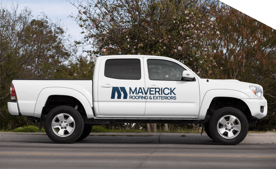 Maverick Roofing truck parked near trees